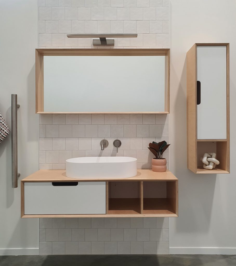 This wall hung ply vanity features one drawer and two cubbies. Paired with matching tower cabinet and mirror, it really can be a beautiful feature in your bathroom. The vessel basin has a matte finish and wall mounted tapware finishes this effortless look off. 
